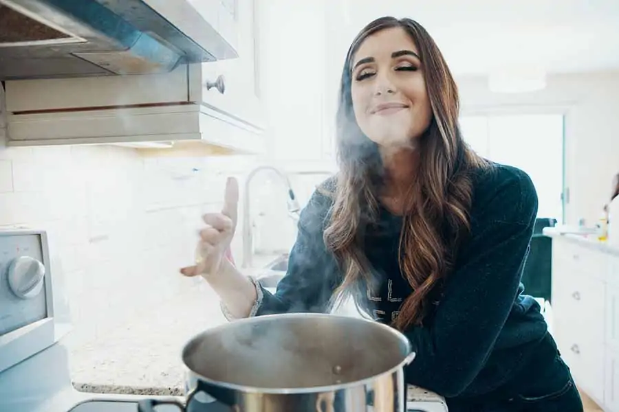 Melissa Maker at the stove with a pot