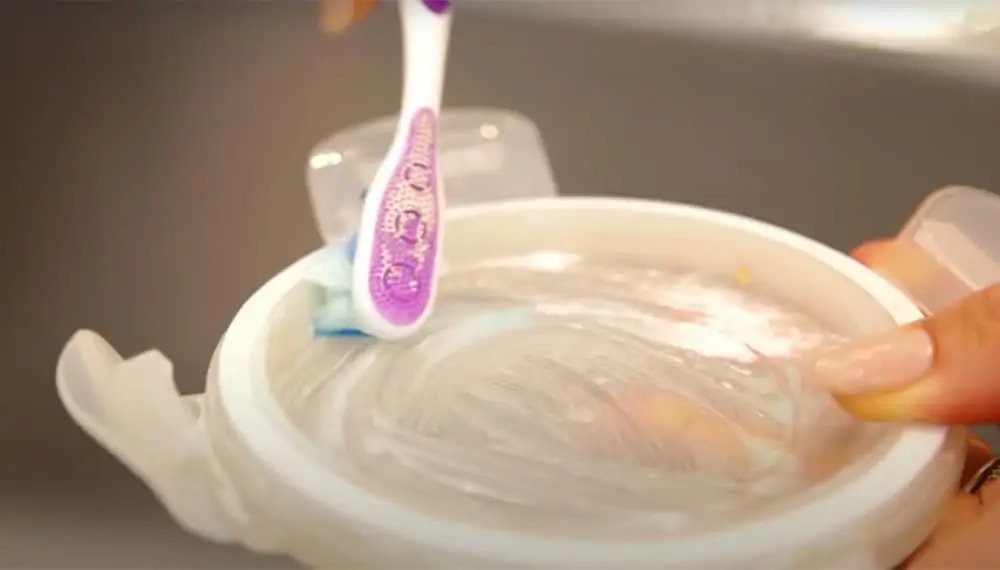 Hand washing a container lid